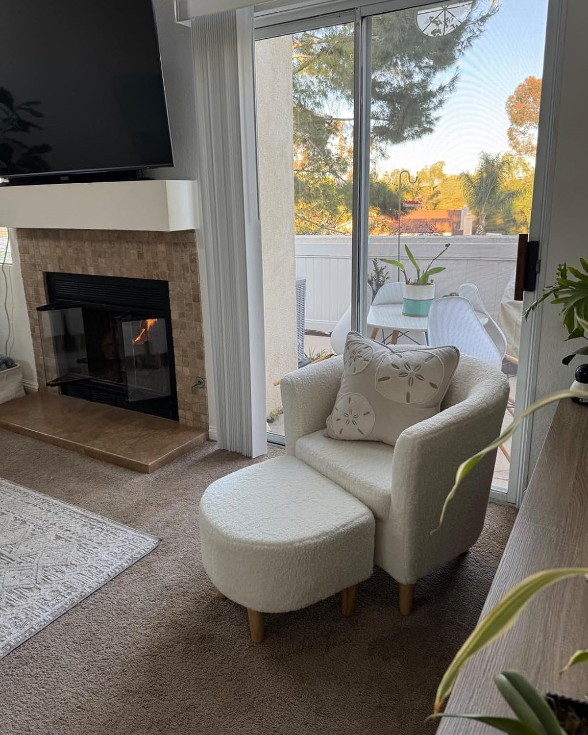 Cream sherpa accent chair set in small living room.