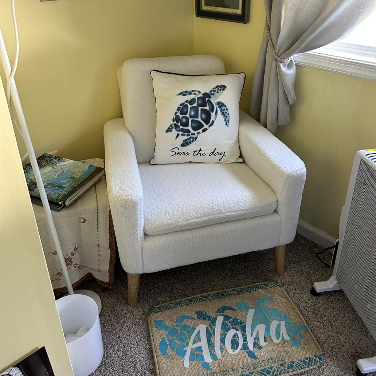 White accent chair styled in living room corner