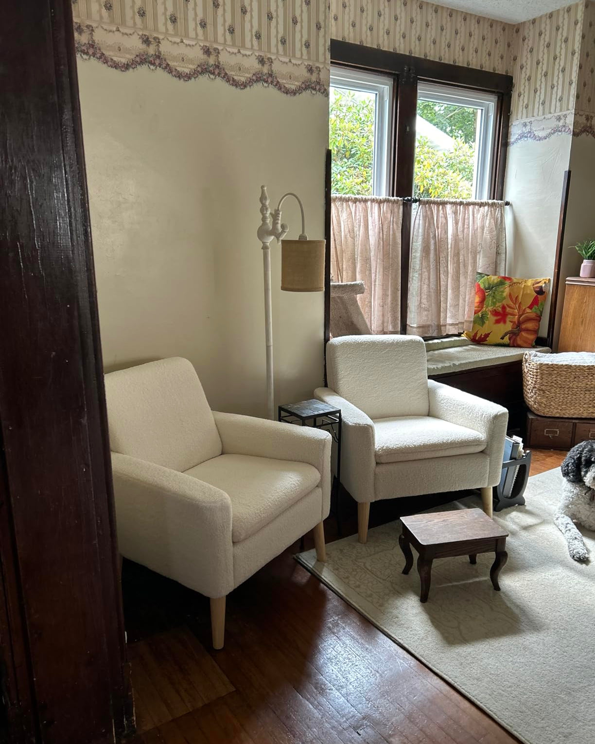 White accent chair with ottoman styled in living room