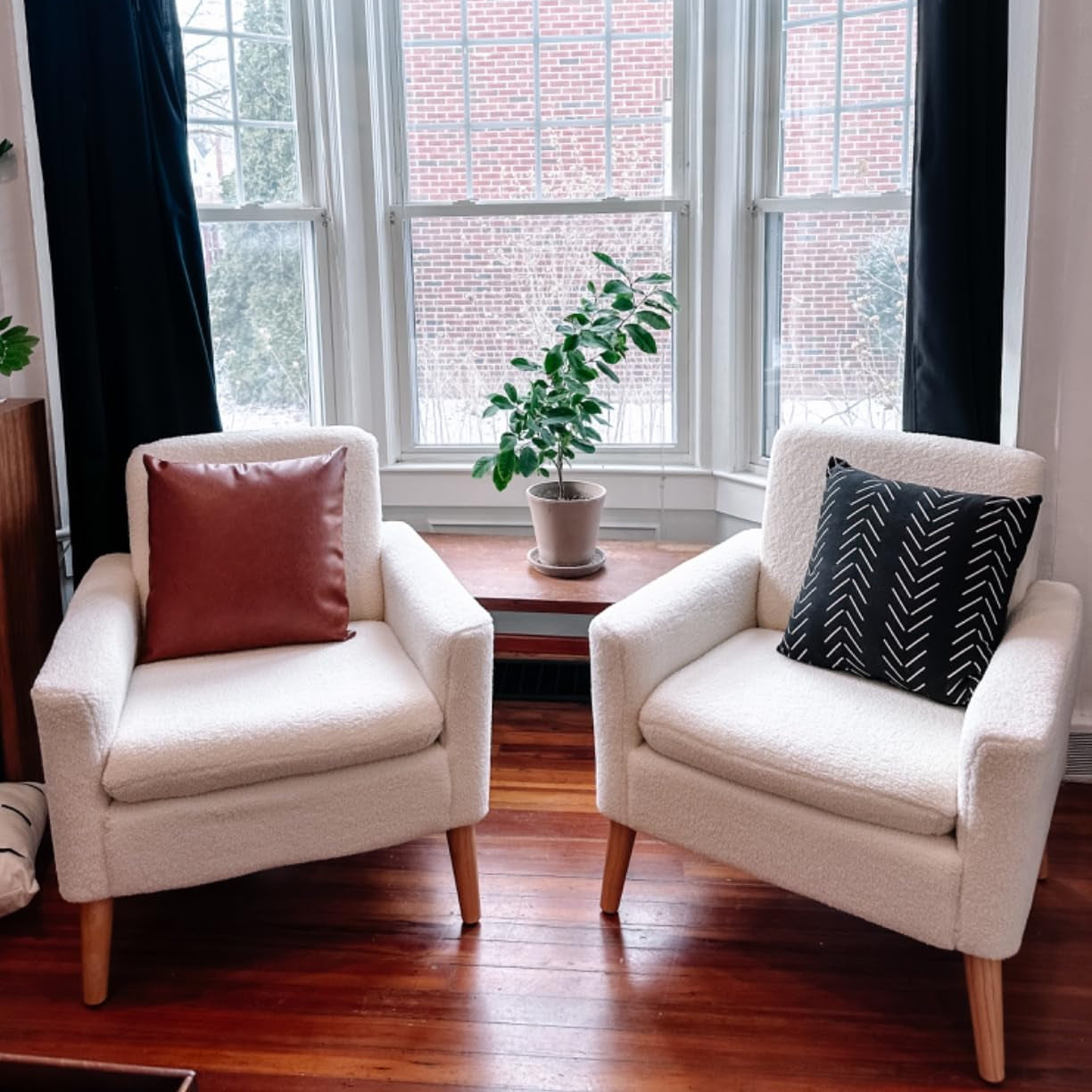 White accent chair styled in living room