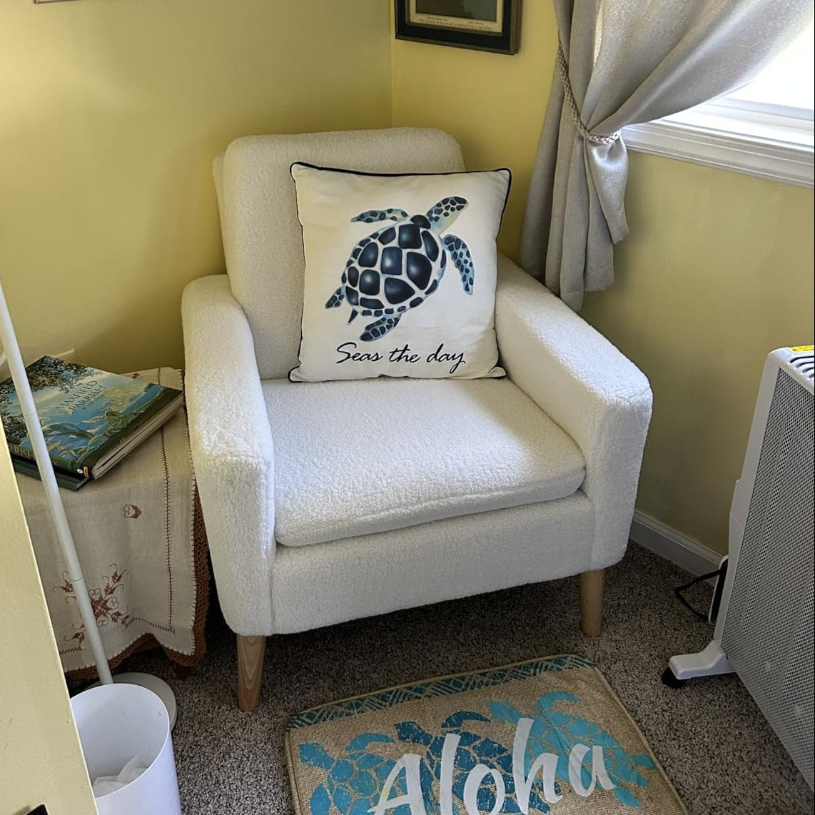 White accent chair styled in living room corner