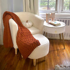 Cream sherpa accent chair with ottoman, 26.5-inch width, small-space friendly.